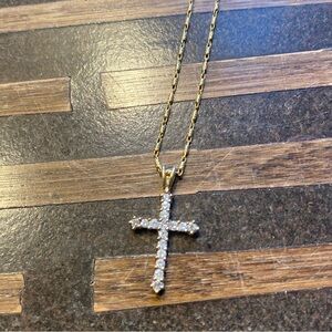 Diamond cross set in gold and gold chain